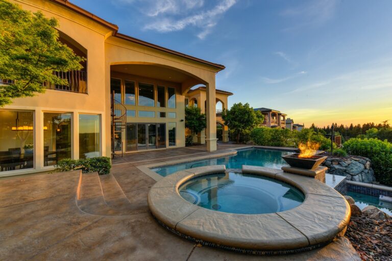 Home exterior with a landscaped outdoor living area